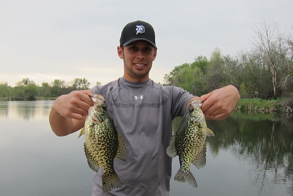 Jordan Rodriguez holding two large crappie