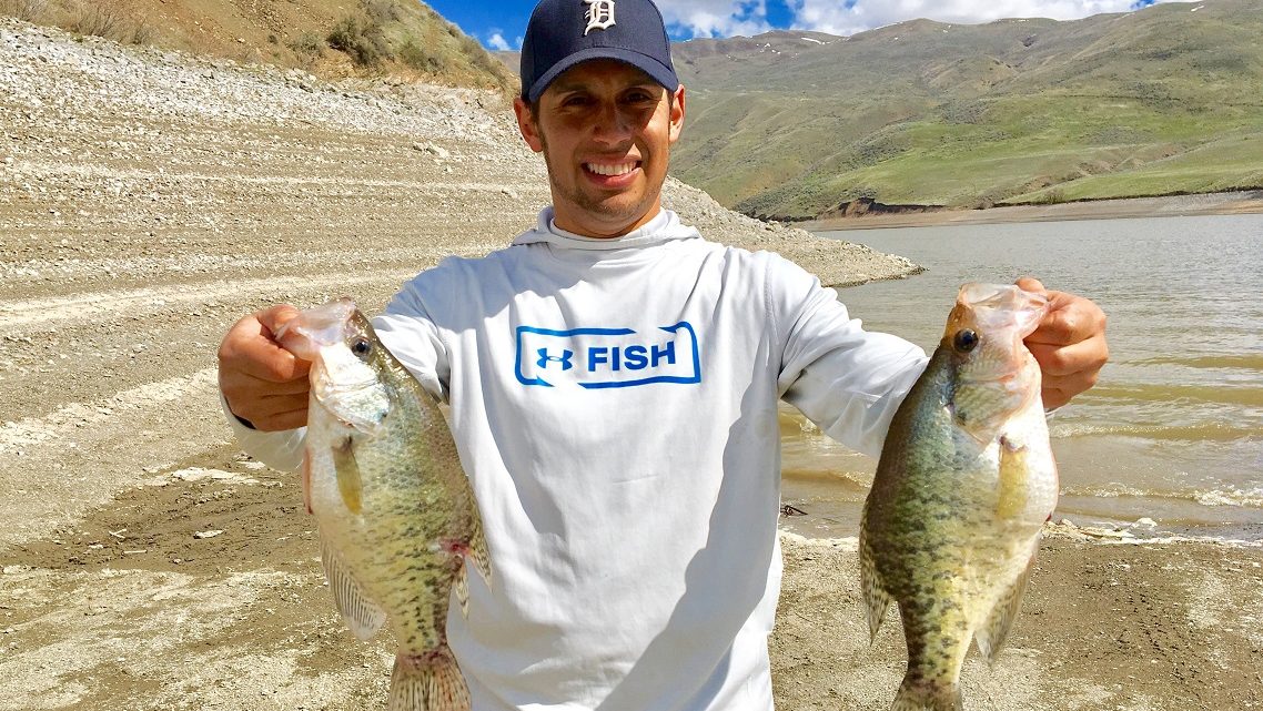 Jordan Rodriguez holding two large crappie