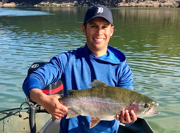 Jordan Rodriguez shows off a large rainbow trout