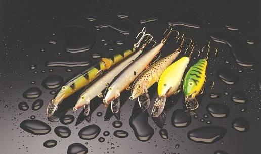 Several Rapala lures on a wet surface.