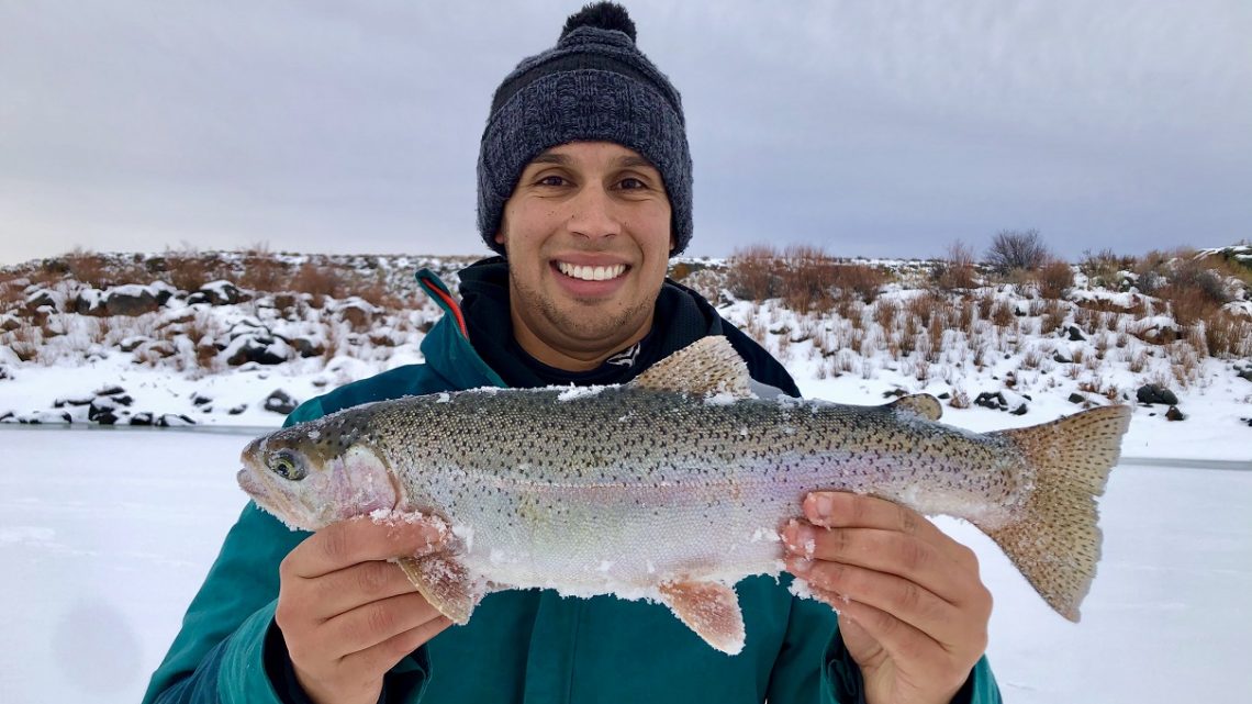 Jordan Rodriguez with a large ranibow trout caught at Magic Reservoir