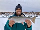 Jordan Rodriguez with a large ranibow trout caught at Magic Reservoir