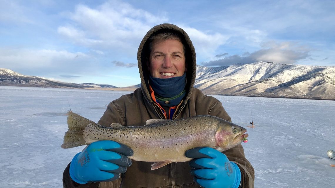 Angler Randal Clayton shows off a large cutthroat trout caught at Henrys Lake