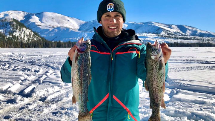 Jordan Rodriguez with two rainbow trout caught through the ice at Warm Lake