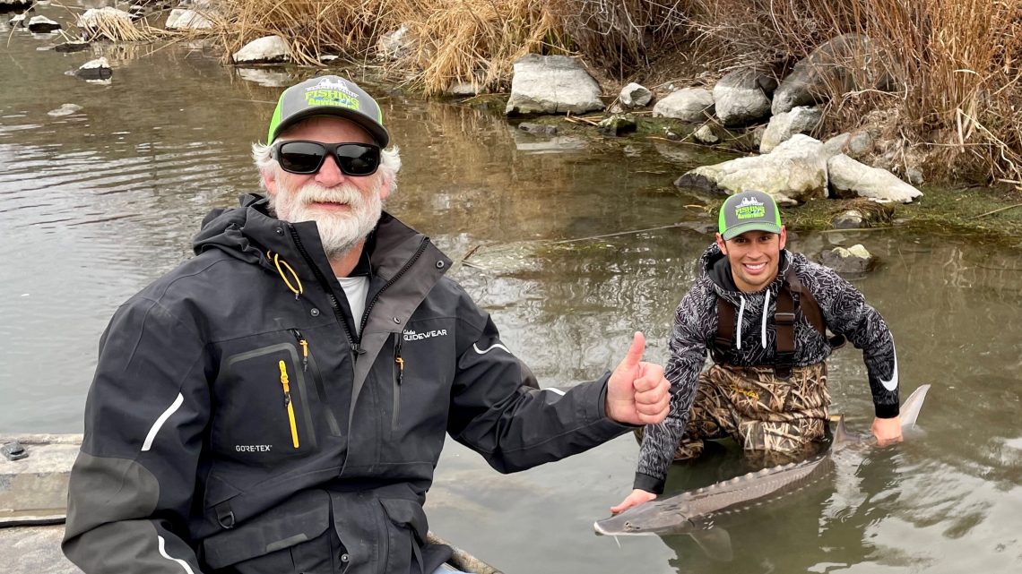 Captain Tim Parrish and Jordan Rodriguez with a 4-foot white sturgeon