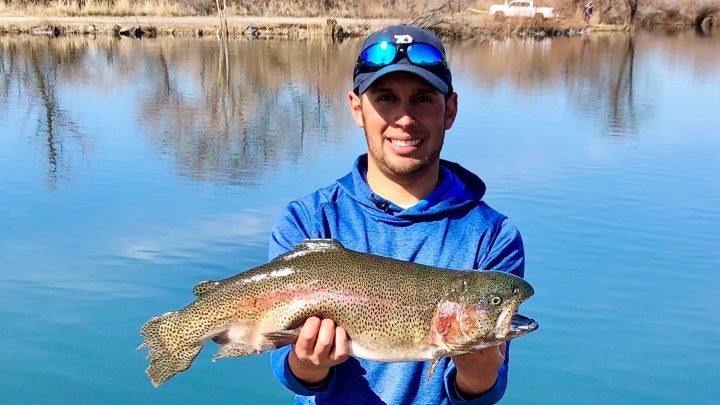 Jordan Rodriguez holds a large rainbow trout caught in Hagerman