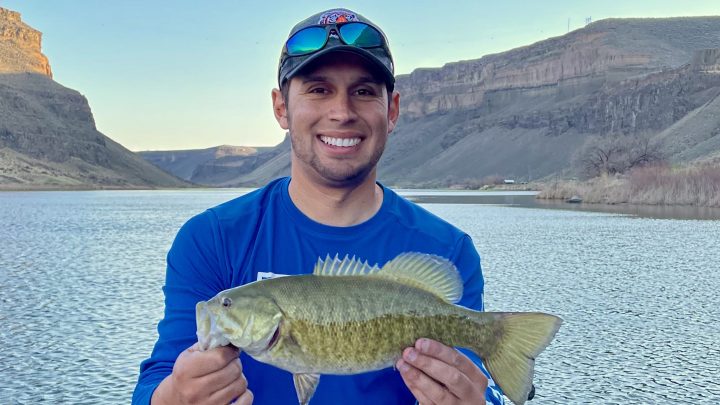 Jordan Rodriguez holds a 16-inch smallmouth bass caught on the Snake River.