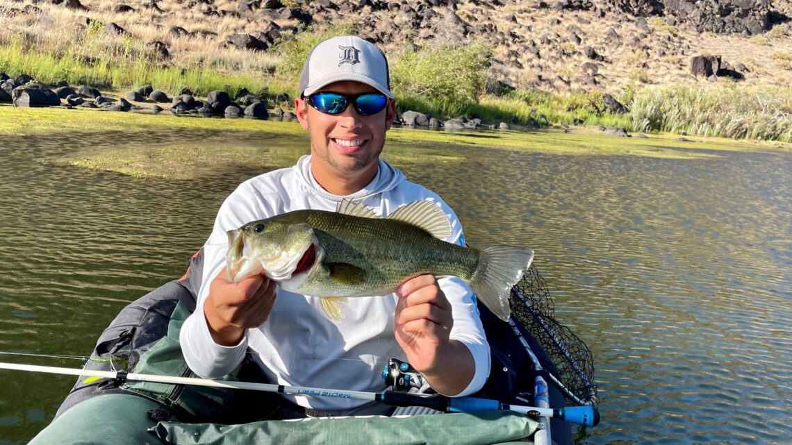 Jordan Rodriguez holding a big largemouth bass