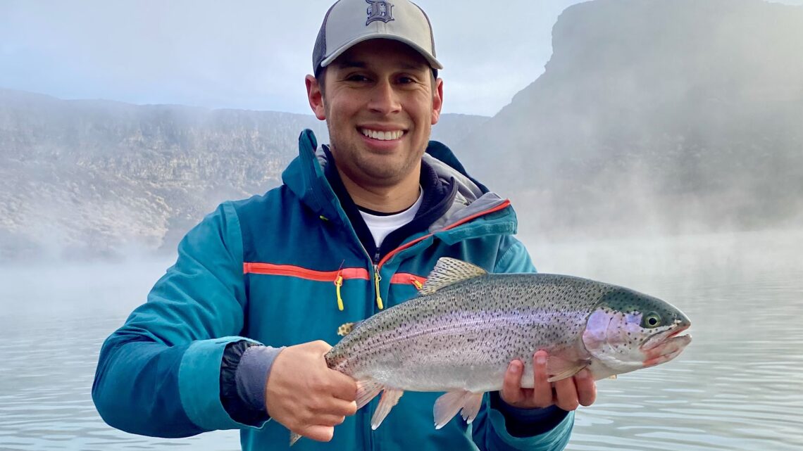 Jordan Rodriguez holds a large rainbow trout caught on the Snake River near Hagerman.