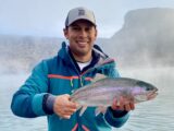 Jordan Rodriguez holds a large rainbow trout caught on the Snake River near Hagerman.