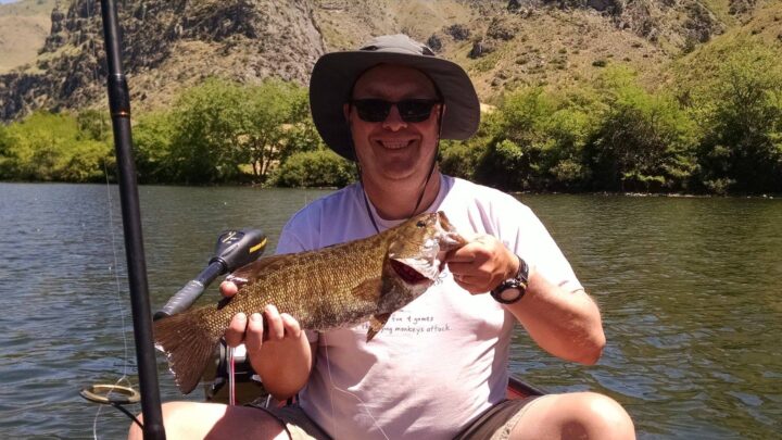 Jeff Cullers, host of the Gem State Fishing Report podcast, holding a nice smallmouth bass