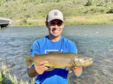 Jordan Rodriguez holds a nice brown trout caught on the Henrys Fork of the Snake River