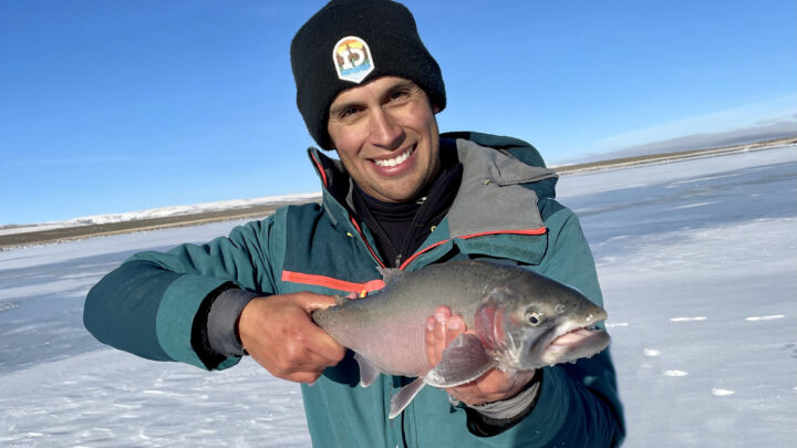 Jordan Rodriguez with a 22-inch cutthroat trout caught through the ice.