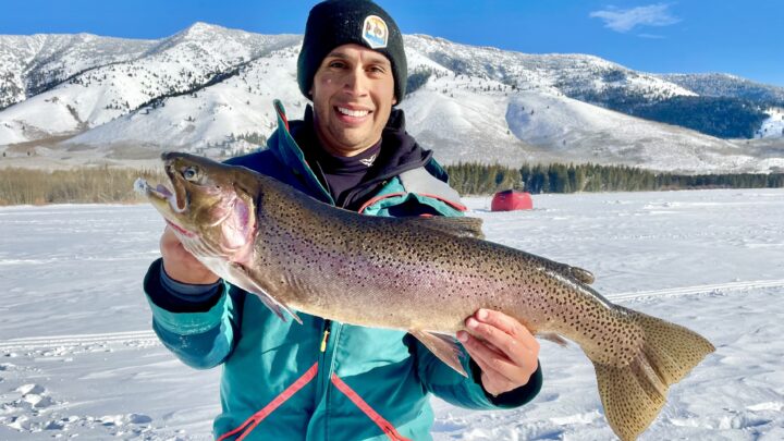 Jordan Rodriguez with Walter, a 30-inch cutbow hybrid trout.