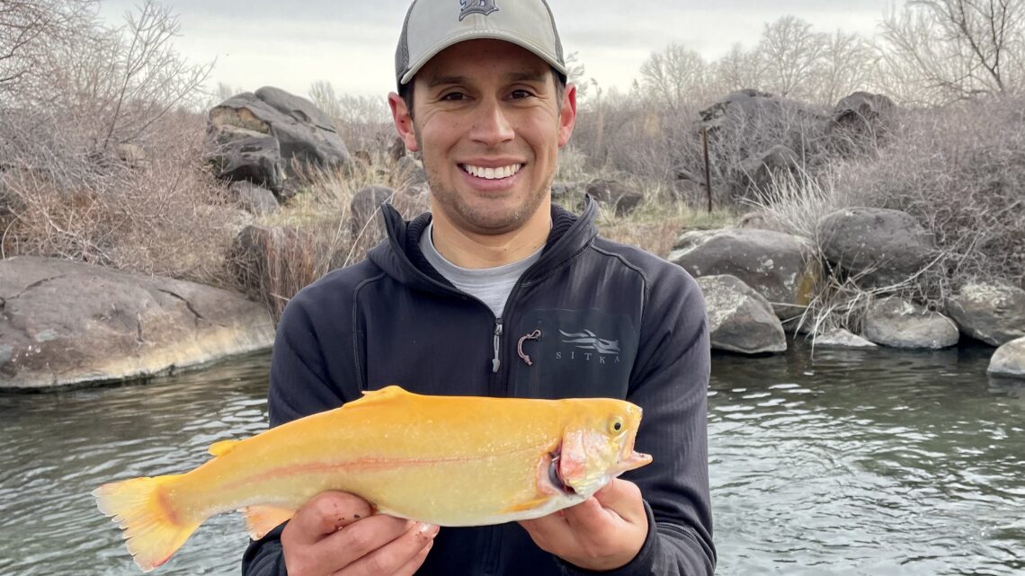 Jordan Rodriguez holds a Palomino trout caught in Hagerman.