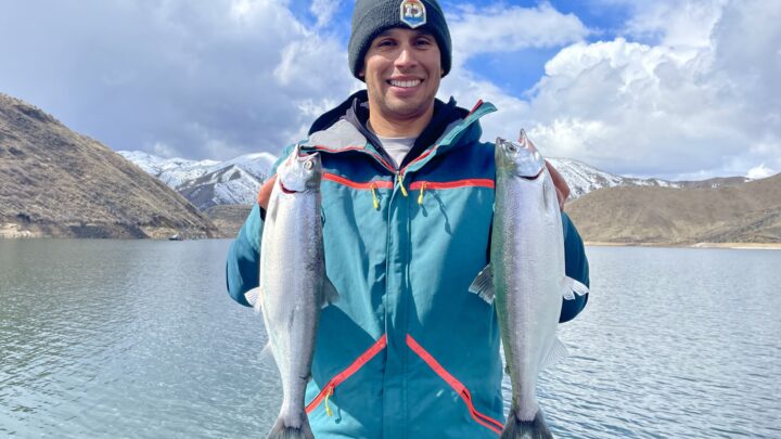 Jordan Rodriguez holding two nice Kokanee salmon caught at Arrowrock Reservoir.