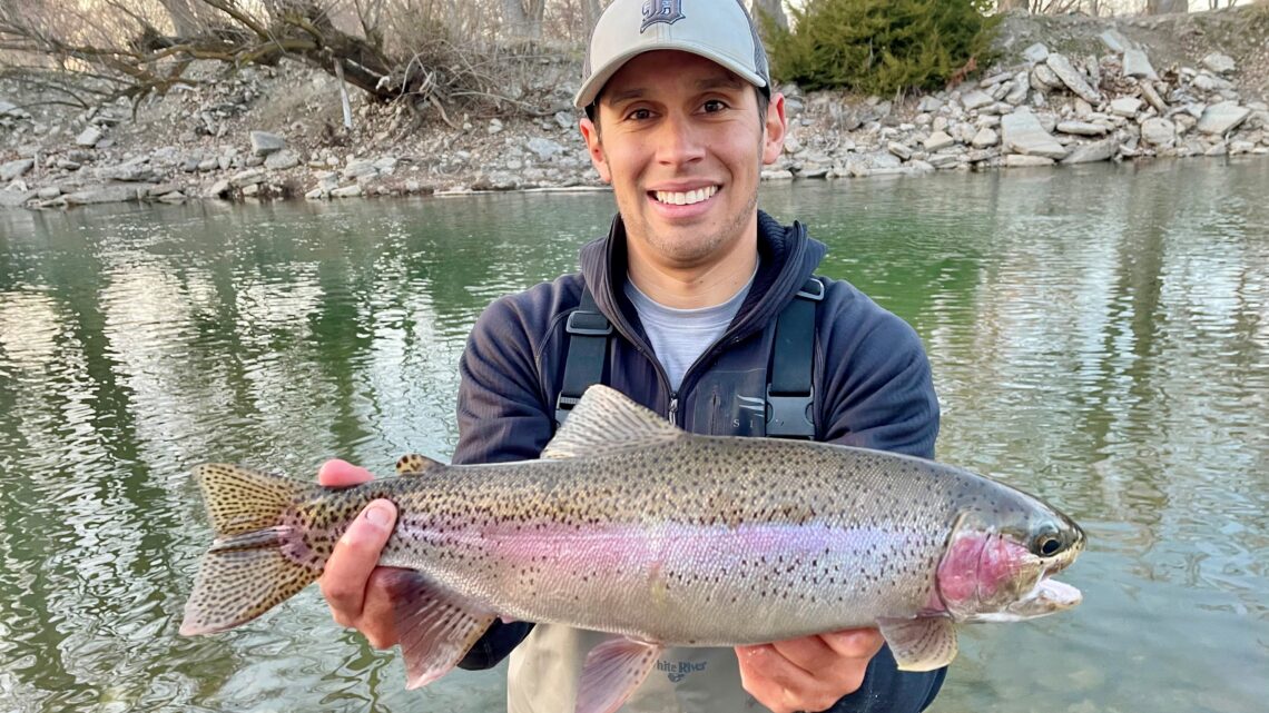 Jordan Rodriguez with a large Boise River rainbow trout.