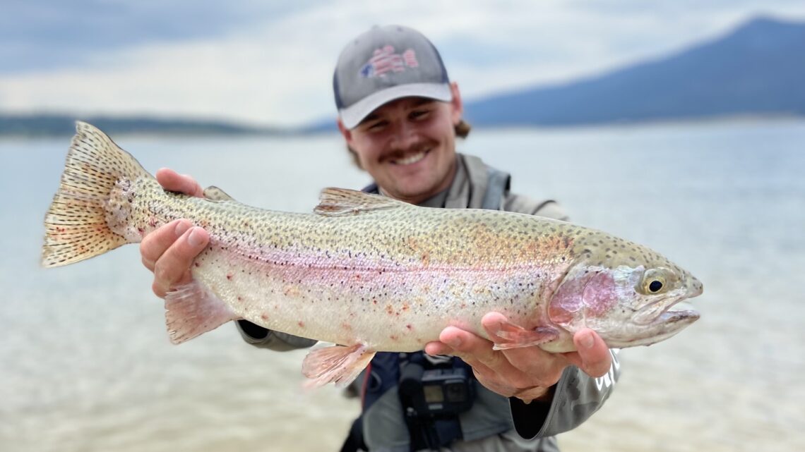 Angler Casey Smith shows off a big rainbow trout caught at Lake Cascade.