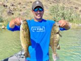 Jordan Rodriguez shows off two big Snake River smallmouth bass.