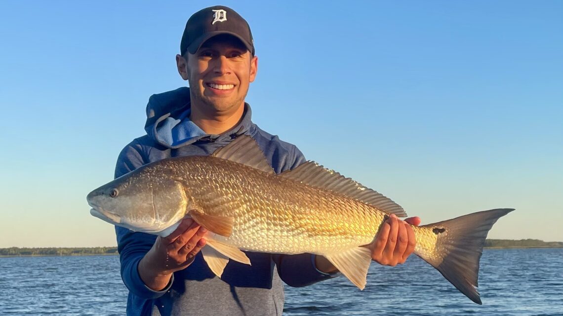 Jordan Rodriguez with a large red drum caught off the coast of South Carolina.