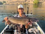 Jordan Rodriguez holding a large channel catfish