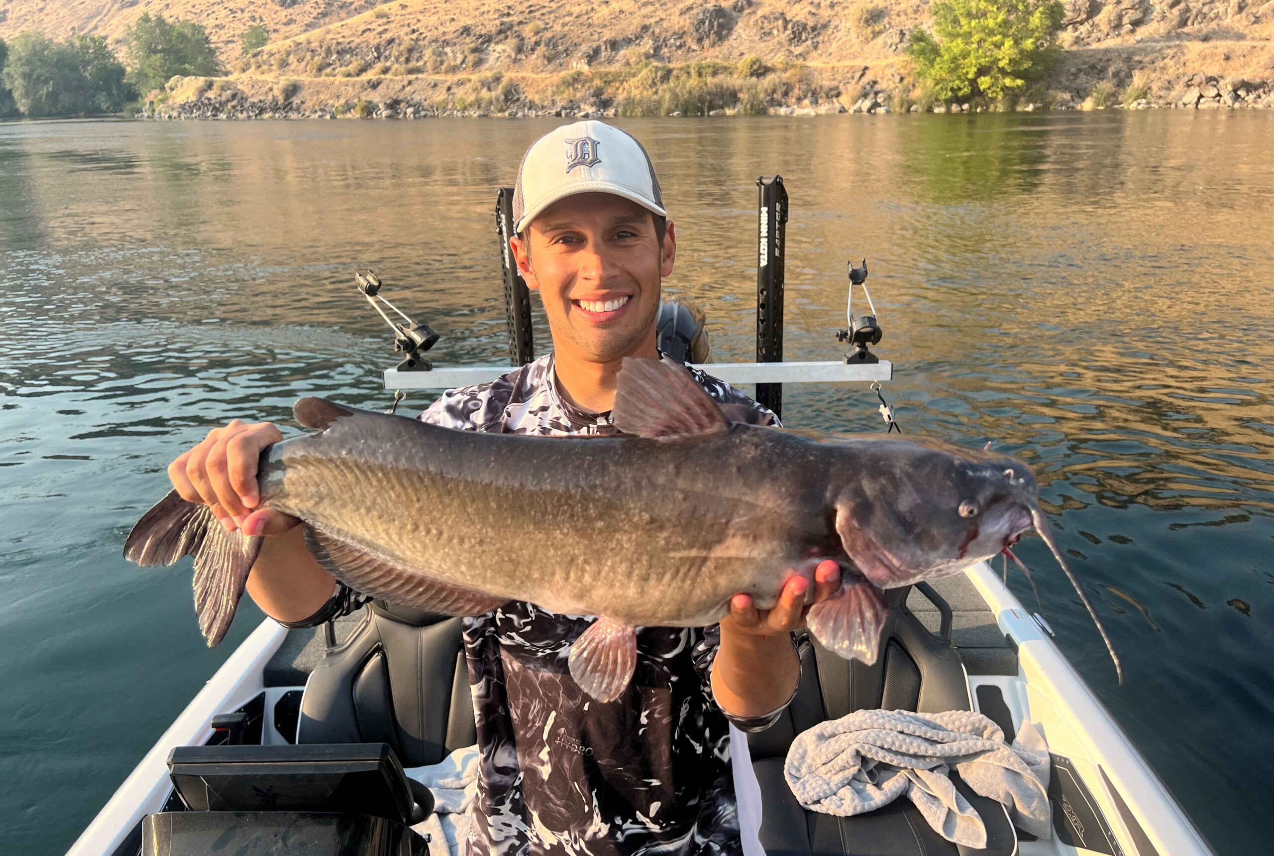 Jordan Rodriguez holding a large channel catfish