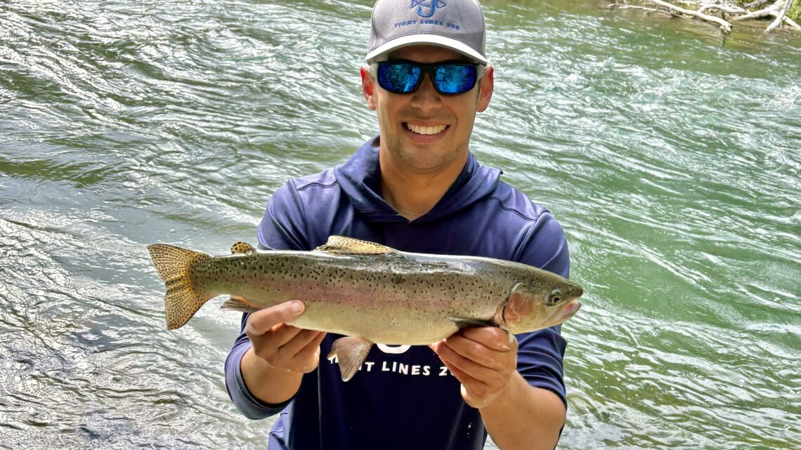 Jordan Rodriguez with a large rainbow trout caught on the Big Lost River in eastern Idaho.