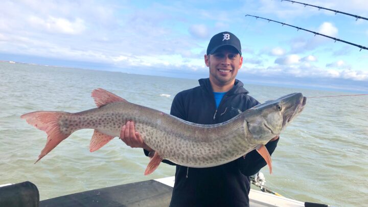 Jordan Rodriguez with a giant Great Lakes spotted muskie.