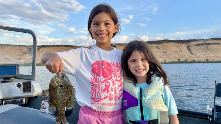 Quinn and Skye Rodriguez with the Idaho state-record pumpkinseed/bluegill hybrid sunfish.